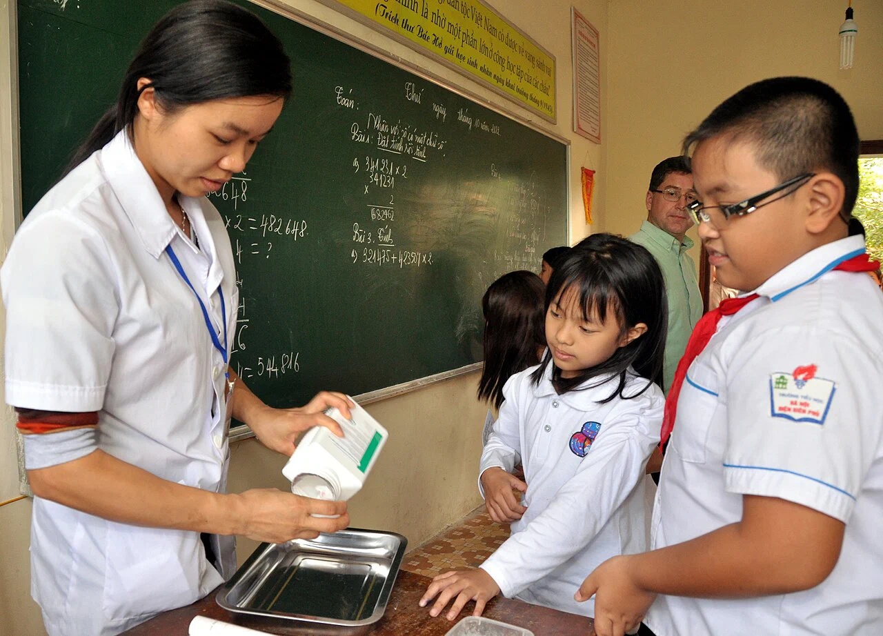 Schoolchildren receiving deworming medicine in Dien Bien, Vietnam, in 2012