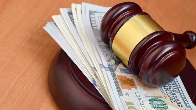 Judge Gavel And Money On Brown Wooden Table. Many Hundred Dollar